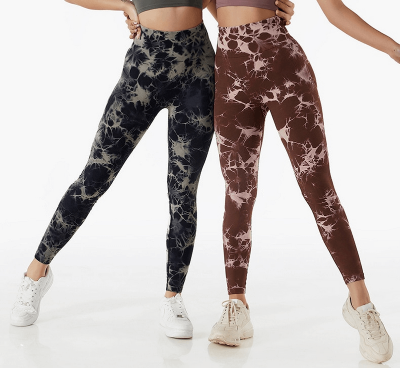 Two women wearing tie-dye patterned seamless elastic high waist leggings for fitness, showcasing stylish activewear.
